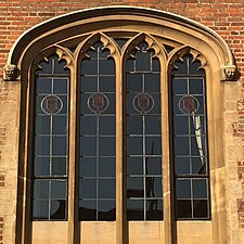 Tudor-style hood mould ending in decorative label stops (Magdalene College, University of Cambridge, England).