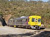 TransAdelaide railcars 3131/3132 exiting Sleeps Hill Tunnel. 09.41 Belair to Adelaide, 9 May 2005