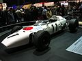 A 1965年 Honda RA272 in the racing colors of Japan.