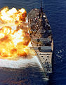 A battleship firing her main battery