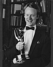 Photo of Scott Elder Harper receiving the first of his two Emmy Awards, 1986.