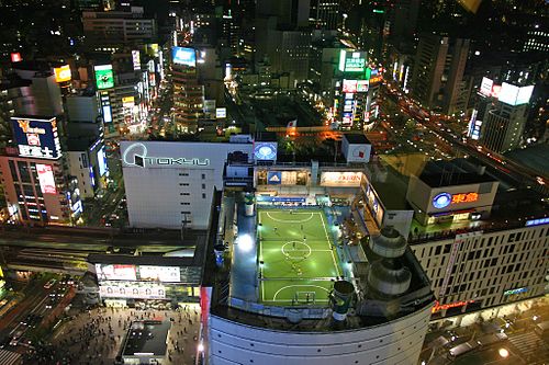 A futsal pitch in use on the top of a tower block in Tokyo, Japan