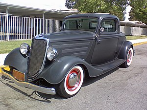 1934 Model 40B or B three window coupe, built in the 1950s hot rod tradition with 1930s style steel wheels and rows of hood louvres