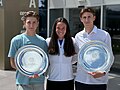 Tereza Valentova with her cousins Jan Valenta (on the left) and Michal Valenta (on the right) holding the 2024 French Open trophies for girls' singles and doubles titles.