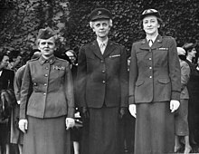 Black and white photograph of three women in military dress.