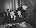 Image 53John L. Lewis (right, President of the United Mine Workers, confers with Thomas Kennedy (left), UMW Secretary-Treasurer of the UMW, and a UMW official at the War Labor Board in 1943 about a coal miners' strike.