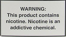 A nicotine warning statement for vaping products sold in the US. It graphic states: WARNING: This product contains nicotine. Nicotine is an addictive chemical.