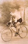 Male cyclist posed riding a bicycle