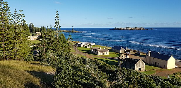 The crank mill ruin and beach store building (foreground) from Flagstaff Hill, Kingston, Norfolk Island, 2018.
