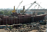 Mazagon Dock Limited (MDL) is India’s prime shipyard. It manufactures warships and submarines for the Indian Navy, as well as offshore platforms and associated support vessels for offshore oil drilling. Show here is Kolkata Class destroyer being built in the Assembly Shop at Mazagon Dock Limited, Mumbai.