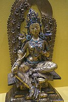 Green Tara c. 15th-16th century, copper with gilding, painted with clay and gold, held in the Tibet Museum.