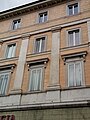 Doric pilaster strips of giant order above pharmacy