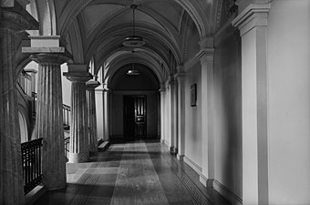 Second floor level of the staircase, with a plaque on the right observing the spot where Schauman shot Bobrikov