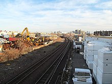 A railway line passing through industrial sites