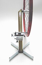 One-armed wheel truing stand