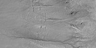 Close view of gully channels, as seen by HiRISE under HiWish program Channels make some tight curves.