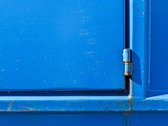 Hinge on blue dumpster