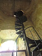 A spiral staircase leading to the top of the bell tower