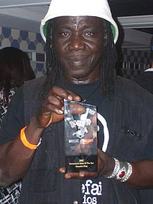 Mamadou Diop holding the 2011 Boston Music Award after winning the prize as International Artist of the Year