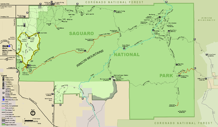 Map of the Rincon Mountain District, an irregular retangle, wider than long, colored green, and surrounded by areas colored brown or light purple that are outside the park