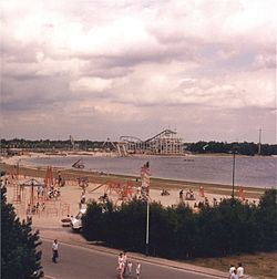 An amusement park with a decent amount of visitors during the evening