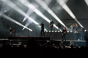 Architects performing live in 2019. From left to right: Adam Christianson, Sam Carter, Alex Dean, Josh Middleton and Dan Searle.