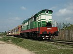 A diesel locomotive-hauled passenger train traveling from Laç to Durrës, Albania, in 2007