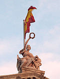 Finial figure of Spain with circular garland, atop the Biblioteca Nacional de España, Madrid, 1892-1903