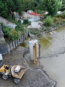 Newly-cast concrete footings for downstream pier