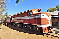 Preserved NSU58 at the Old Ghan Heritage Railway and Museum, Alice Springs, in 2015, with a rake of carriages from the legendary narrow-gauge train, The Ghan. As of 2020[update], it was one of two NSU class locomotives in near-operable condition.