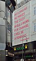 "As long as he makes the cash while I work for change, I will be a feminist.", Tuchlauben, Vienna, Austria[20]