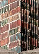 Glazed shaped tiles on the south gable