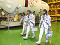 Crew members during a suited "fit check" of the Soyuz TMA-05M spacecraft at the Baikonur Cosmodrome.