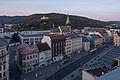 Ústí nad Labem, street view Mírové Náměstí to the west from Interhotel Bohemia with church (kostel Nanebevzetí Panny Marie) in the background