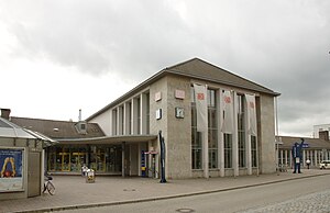 Two-story stone building with hip roof