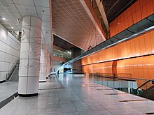 Sculpted white pillars supporting the CCL station at the spacious concourse level