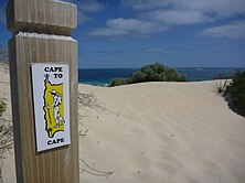Picture of Cape to Cape track marker on a beach.