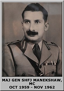 A photograph of Manekshaw wearing the Commandant's uniform, the dates of his service in this role are displayed in a caption