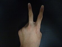 A "V sign" with the fingers can mean "peace" in some situations and "up yours" in others.
