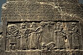 The Black Obelisk of Shalmaneser III. The king, surrounded by his royal attendants and a high-ranking official, receives a tribute from Sua, king of Gilzanu (north-west Iran), who bows and prostrates before the king. From Nimrud, northern Mesopotamia (Iraq). Neo-Assyrian period, 825 BC. The British Museum, London.