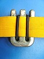 Clip-on trim weight on harness webbing (back view showing shock cord gripping webbing)