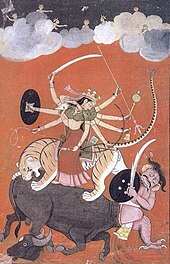Painting of an eight-armed goddess riding a tiger biting a buffalo demon