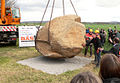 Being lowered into place at the new location