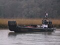RM landing craft loaded with a Massey Ferguson 135 Tractor travelling down the River Tamar