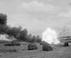 An ammunition carrier of the 11th Armoured Division explodes