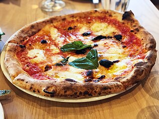 Charred crust on a pizza Margherita, an acceptable trait in artisanal pizza