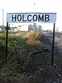 The railroad sign for Holcomb. As viewed looking North