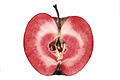 A sliced fruit of a Redlove apple