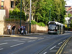 A southbound tram descends the steep gradient