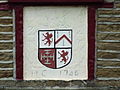 Arms of the Chetham family above the door of the Chetham Arms pub